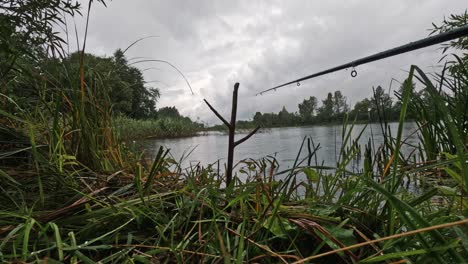 timelapse of fishing rods in the lake rainy cloudy summer day