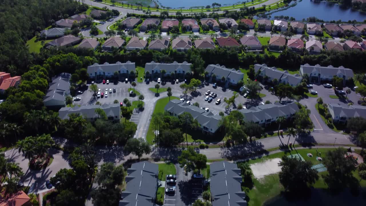 Wealthy residential neighbourhood, Naples, Florida. Beautiful single family homes. Aerial tilt up