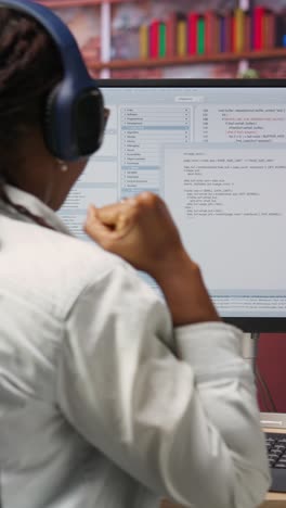 vertical video excited programmer testing code on pc, clapping hands after positive result