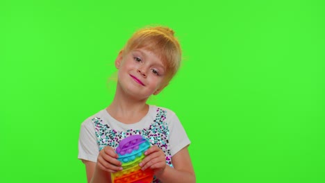 Cute-girl-playing-with-pop-it-sensory-anti-stress-toy,-stress-anxiety-relief,-chroma-key-background