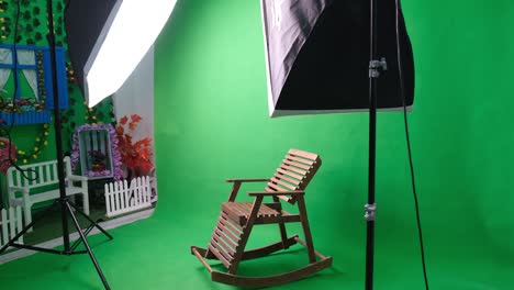 photo or video studio with two hexagone studio lights. green screen and fixed chair