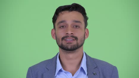 young handsome bearded persian businessman in suit