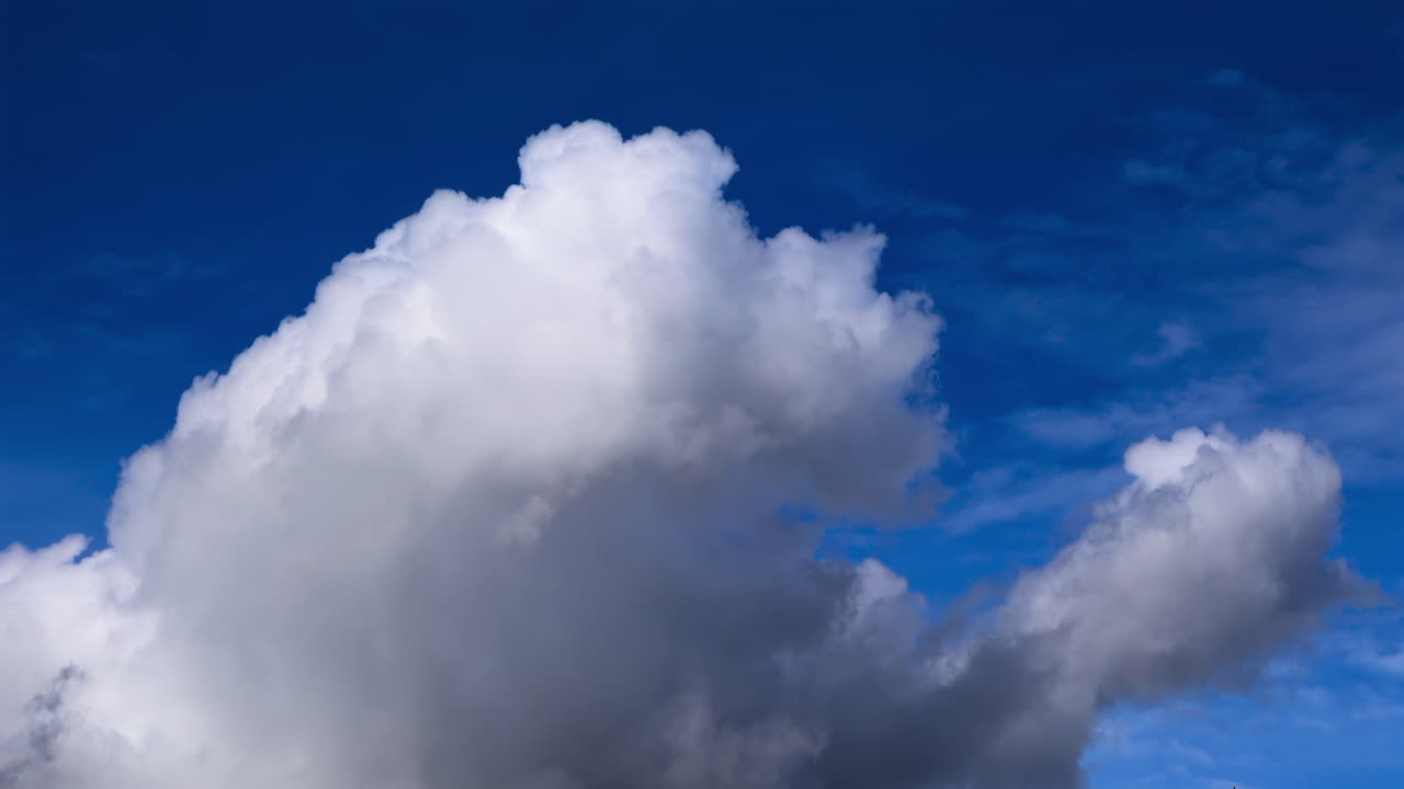 View of white clouds, fluffy moving on the blue sky