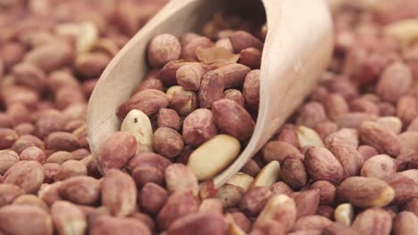 peanuts in a wooden scoop