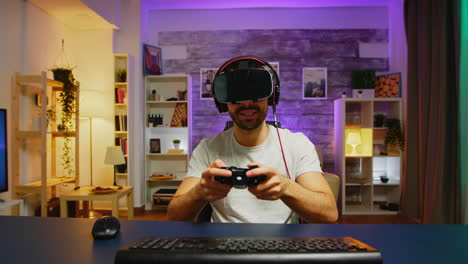 happy young man after his victory while playing video games