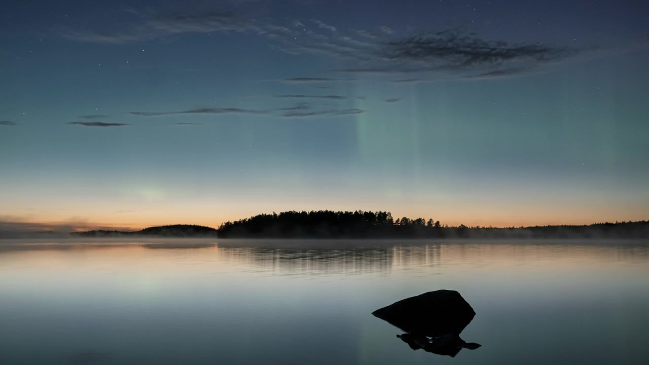 Aurora Borealis Time Lapse Over Calm Lake with Forest and Mist