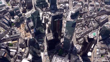 Steep-aerial-view-of-Bishopsgate,-Leadenhall-and-Lime-Street-towers,-City-of-London,-UK