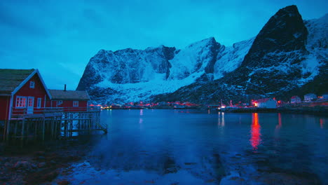 cinematic shot of waterside homes in reine, lofoten
