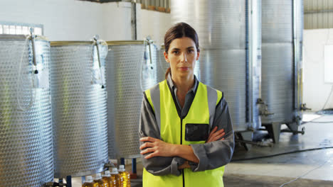 worker standing with arms crossed