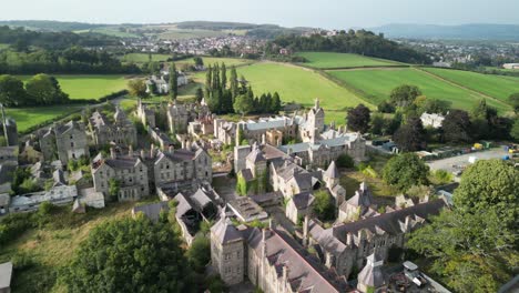 haunted denbigh lunatic asylum, north wales, aerial anticlockwise rotate and move in from far, sunny afternoon