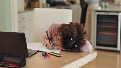 girl doing homework at home
