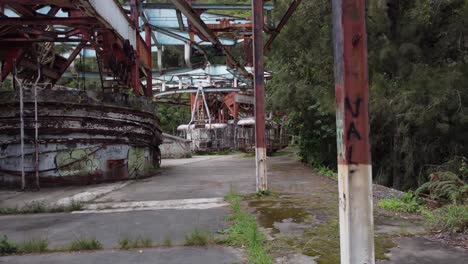 Drone-flight-travelling-inside-the-ruins-of-the-old-cable-car-station-El-Liron,-located-in-San-Antonio-de-Galipan,-Venezuela