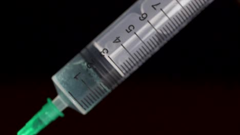 close-up of a syringe filled with clear liquid