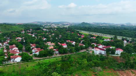 Aerial---forward-approach-shot-of-a-gated-community-in-Sub-saharan-Africa