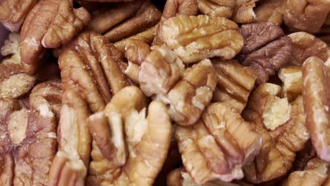 fresh pecan nuts arranged in a close-up view, showcasing their texture and shape