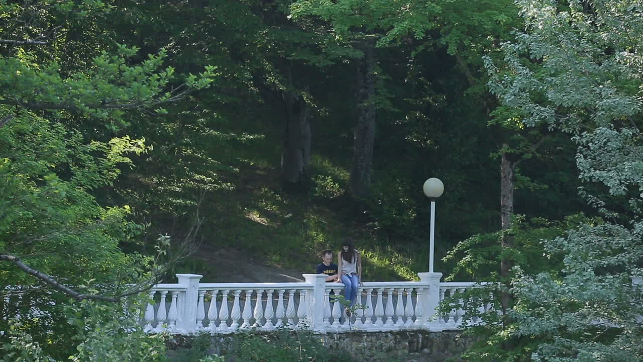 Happy couple on vacation. Outdoor shot of young couple in love enjoying landscape