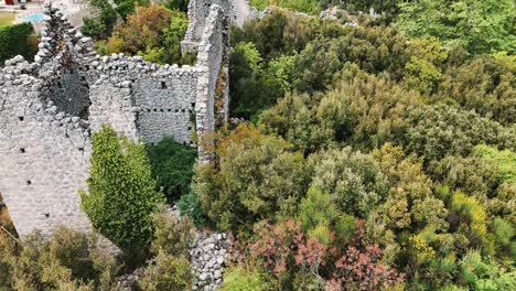 Aerial-View-of-the-Ruins-of-the-Ancient-Roman-Kadrema-Castle-Located-in-the-Gedelme-Village-and-Mountain-Ridge-on-Background