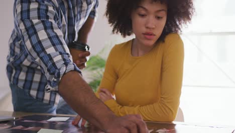 Close up view of two colleagues working in creative office