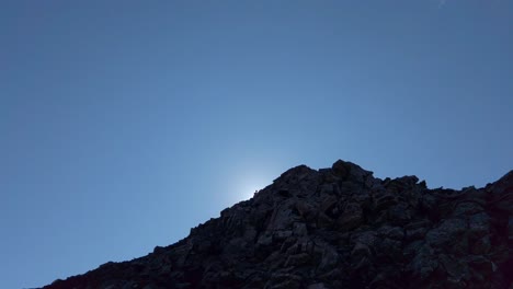 hiker in distance back lit revealed slow motion kananaskis alberta canada