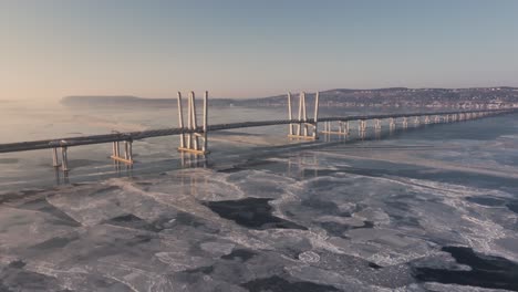 4k drone footage from high above a frozen hudson river just north of nyc.