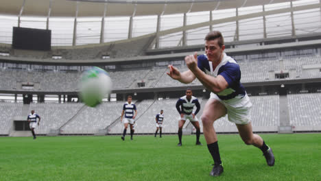 Animación-De-Formas-Negras-Sobre-Jugadores-De-Rugby-Masculinos-En-El-Estadio.