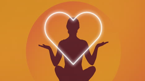 animation of silhouette of woman meditating over heart