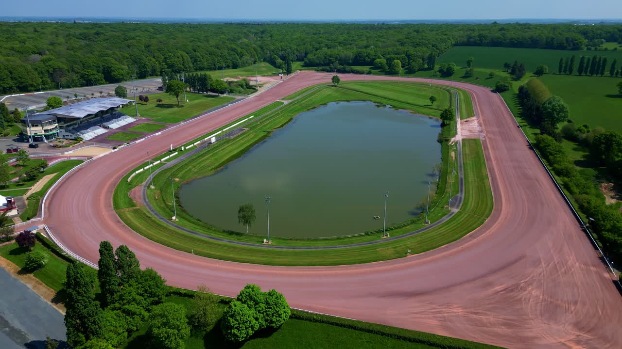 Hippodrome de Laval racecourse and surrounding area in Laval, France. Ideal for sports and leisure content. Aerial drone ascending