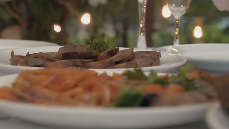 table is served with salmon and fried meat