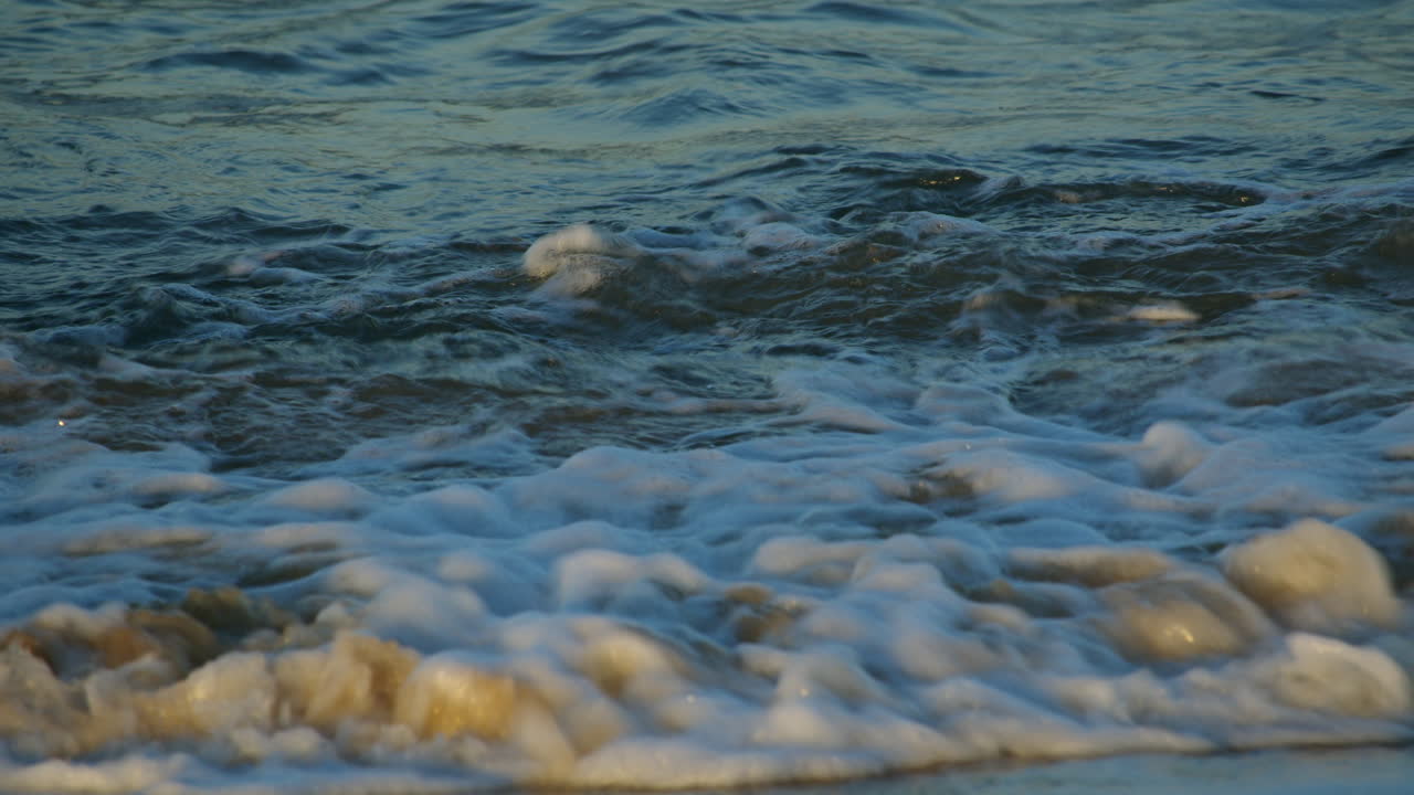 Shot of the sea lapping onto the beach at Caister on Sea