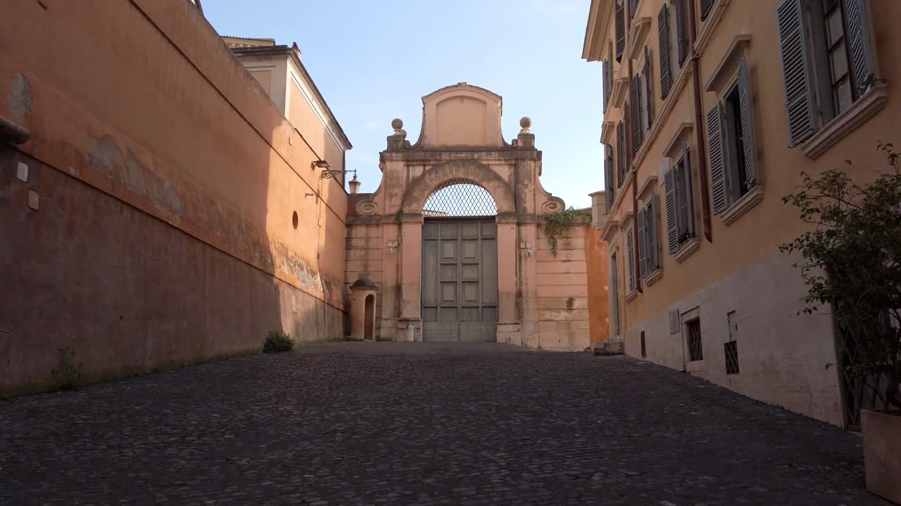 Walking on a pedestian street of Rome leading to a secondary entrance of Quirinal palace,  official residence of the President of the Italian Republic in the capital