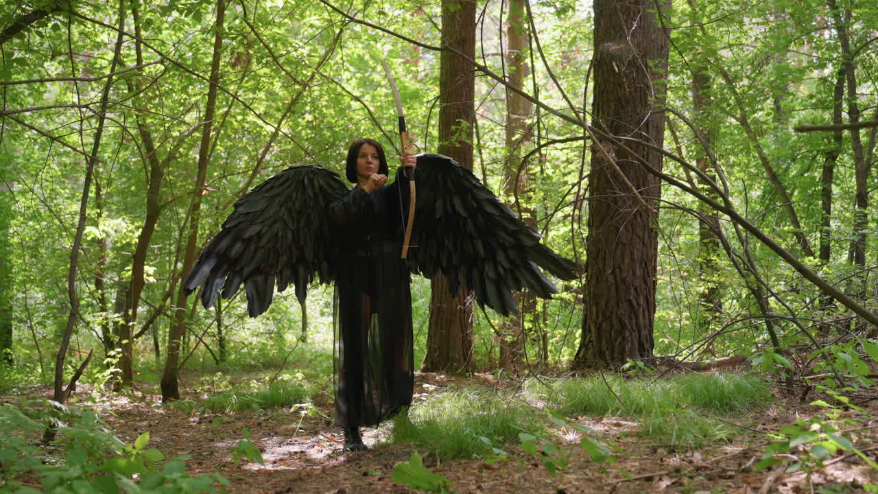 Archer goddess with black wings stands among tall green trees in forest, aiming arrow into distance, sunlight filtering through leaves, symbolizing strength, divinity, and harmony with wild nature