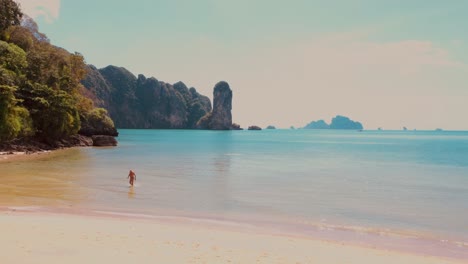 Man-Leaving-Water-At-Ao-Nang-Beach,-Thailand