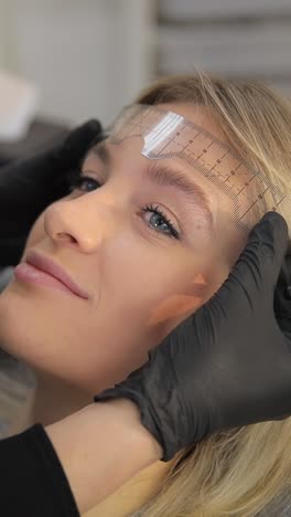 microblading permanent makeup tattoo close up eyebrow tattoo in beauty salon the master makes permanent eyebrow makeup with a needle tattoo machine master makes permanent eyebrow makeup procedure using special needle tattoo machine to woman in beauty salon brows tattooing