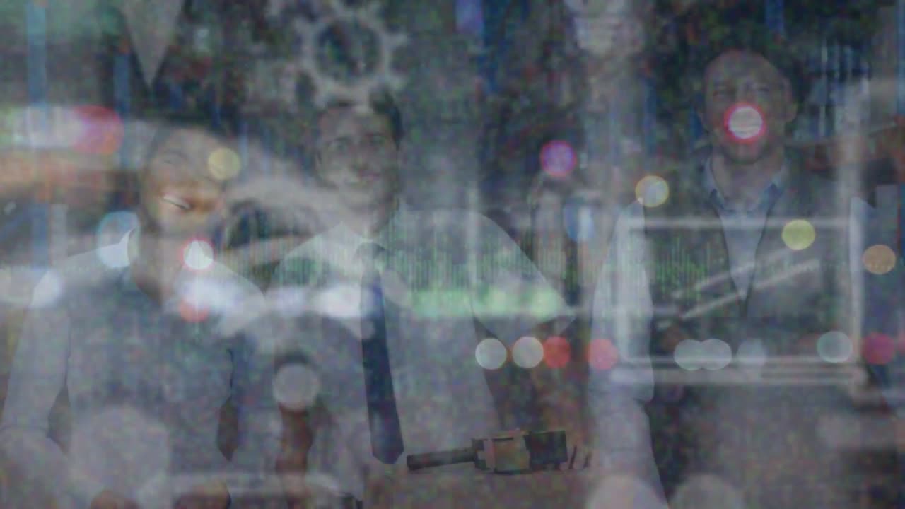 Animation of network icons with bokeh effect against smiling caucasian colleagues in warehouse