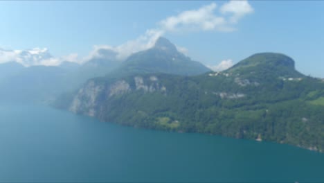 Morschach-Flyover:-Moving-Over-Scenic-Water-Valley-Towards-Alps-Mountains,-Switzerland,-Europe,-Drone-|-Very-Slow-Movement-Towards-Breathtaking-Mountainside