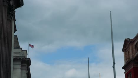 british flag waving near historic museum building