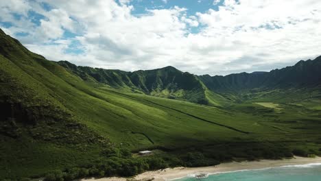 aerial shot of the beautiful makua valley and makua beach on a sunny day on west oahu, hawaii