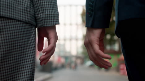 Teenage-boy-and-girl-holding-hands