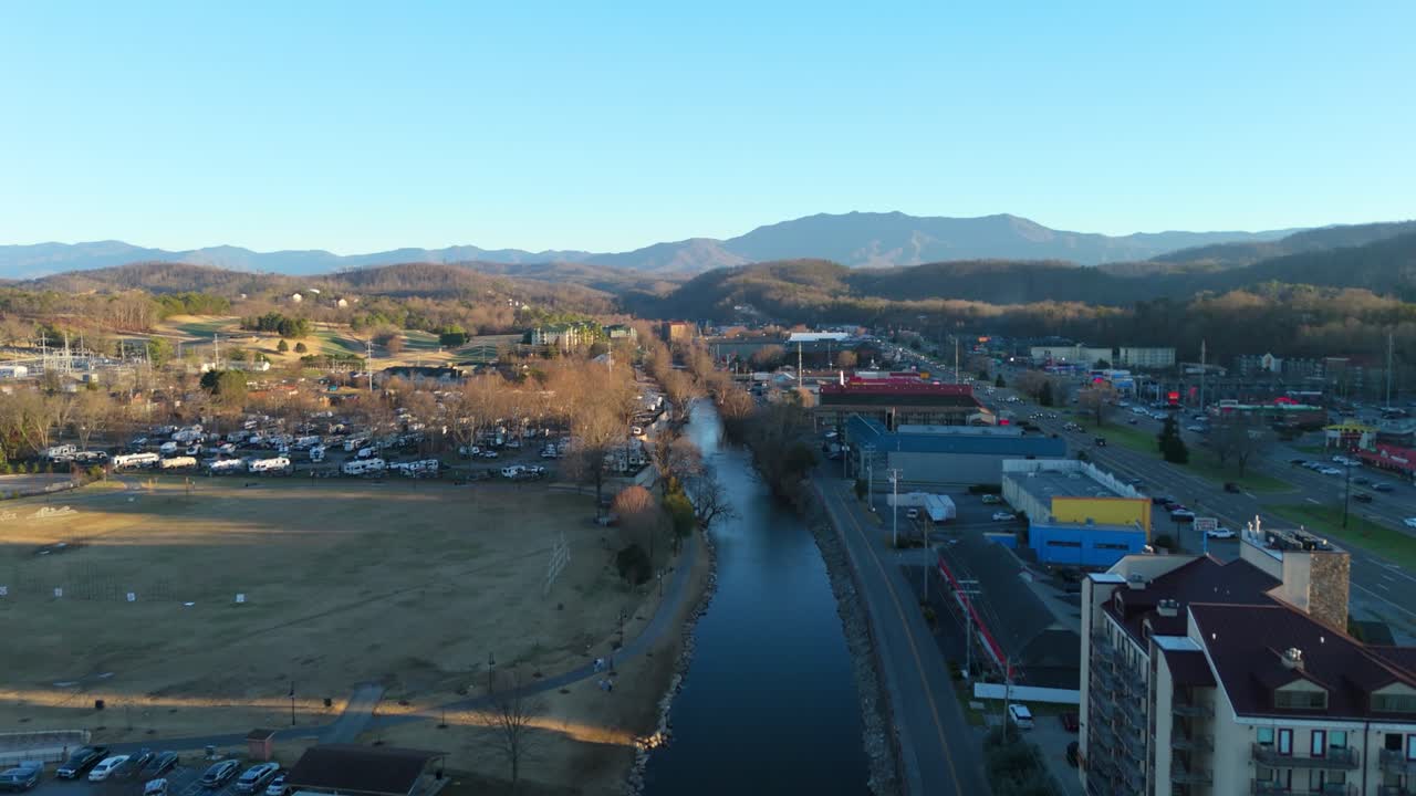 Piegon Forge, TN aerial push in at sunset above the West Prong Little Pigeon River.