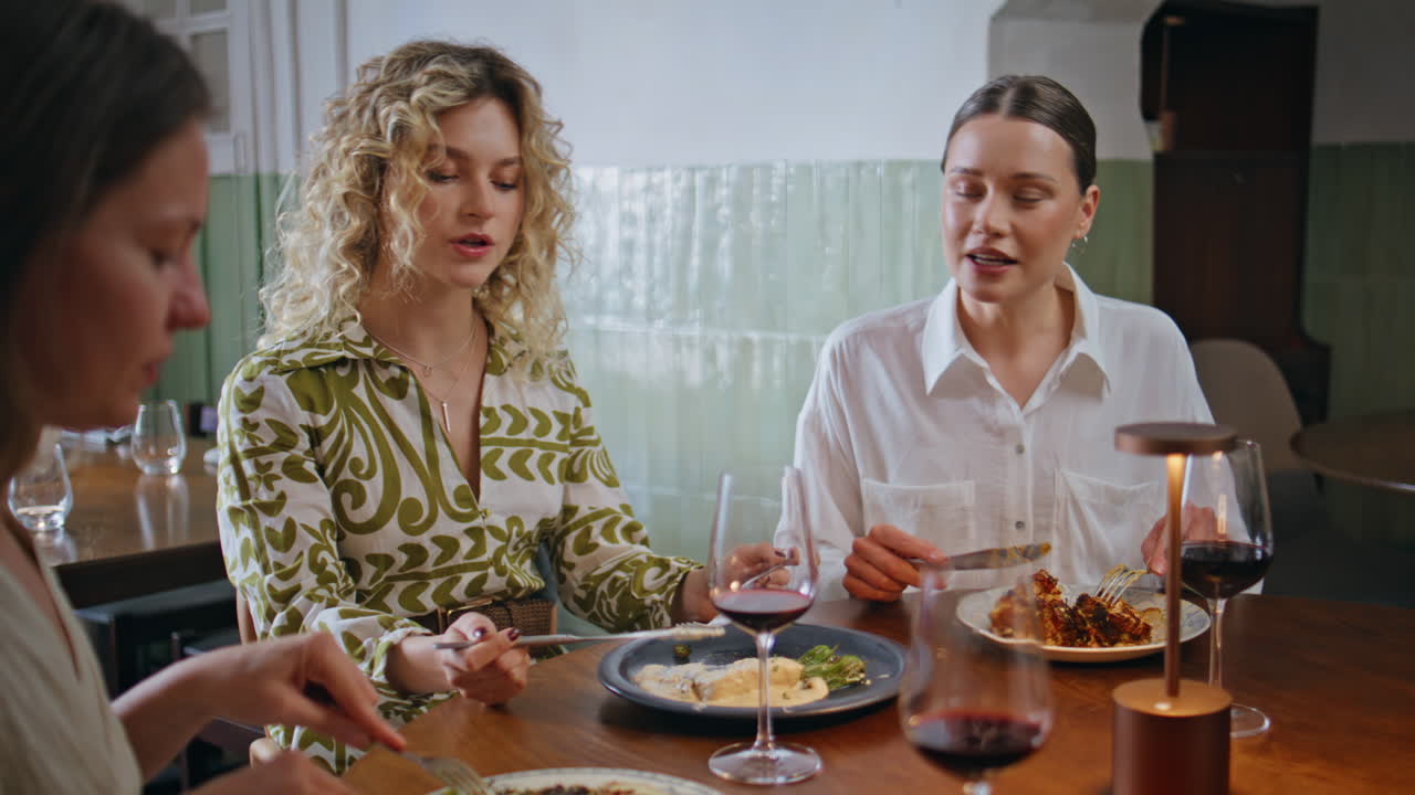 Group ladies enjoy meeting in cafeteria closeup. Three stylish women talking