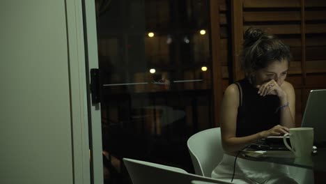 remote worker female digital nomad working online from coffee shop living room