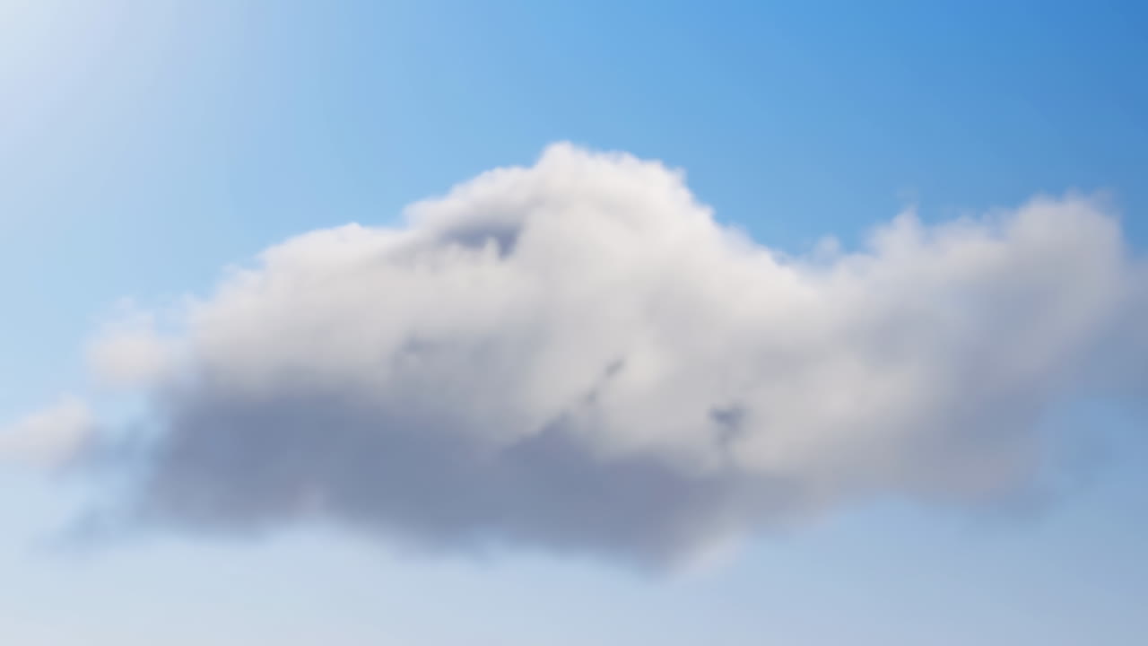Fluffy White Cloud Drifting in a Clear Blue Sky