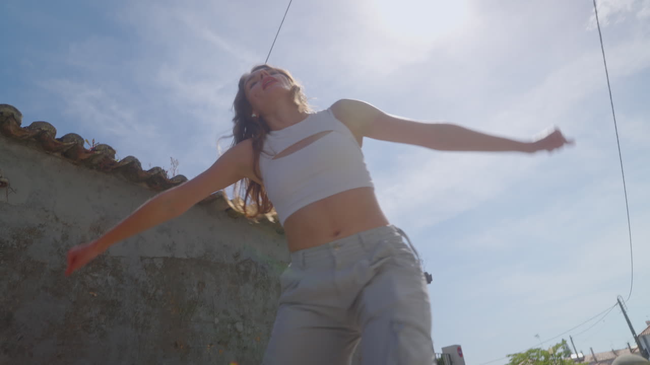 Woman walking outdoors on a sunny day