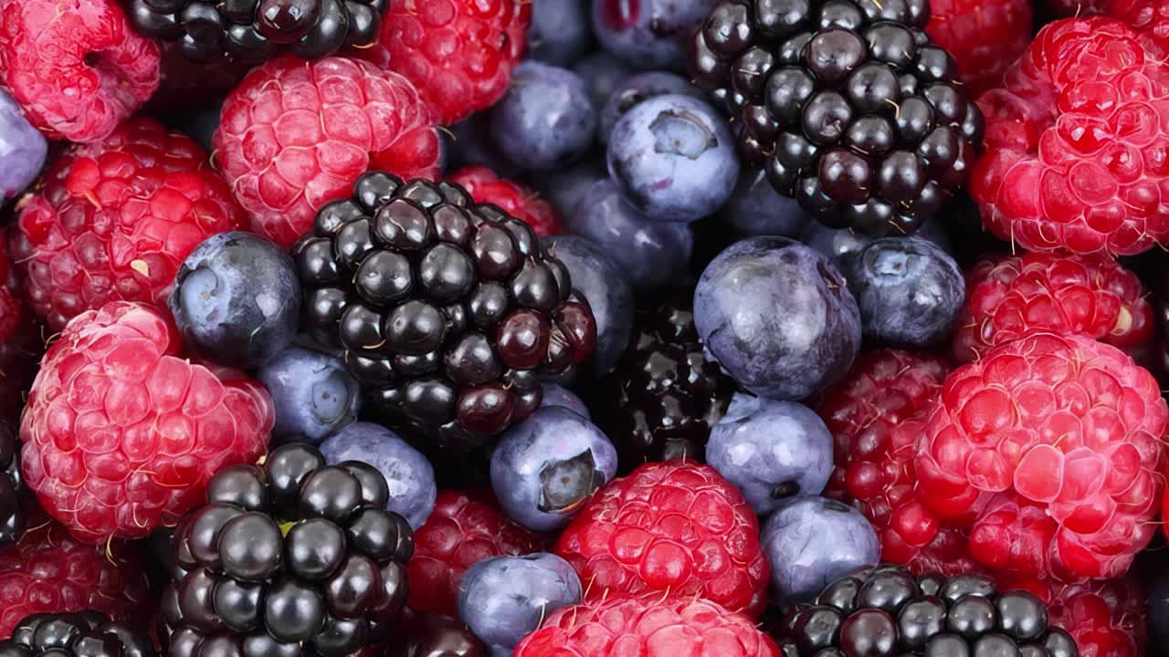 Blueberries, Red and Blue Raspberries. Fruit Background