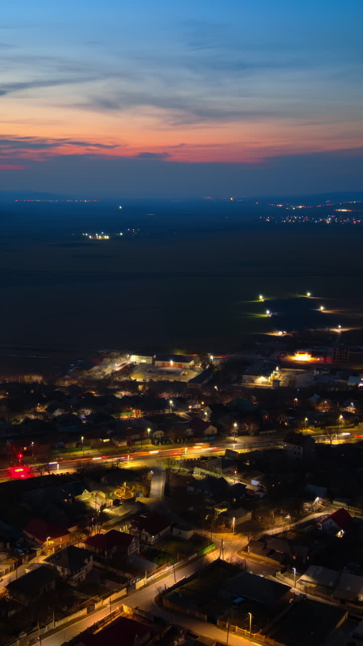 Aerial drone view of cars moving through Chisinau, Moldova at sunset time lapse. Vertical