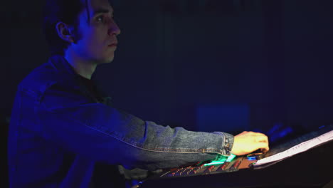 lighting technician working on a lighting console