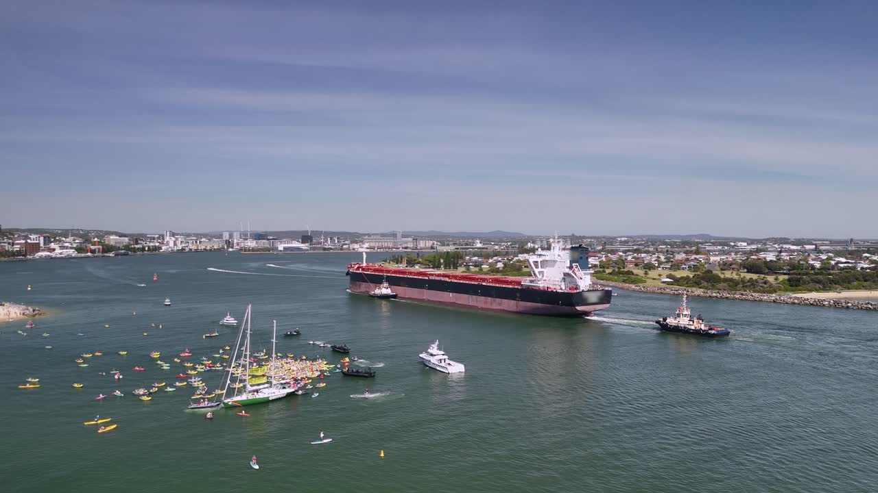 Kayakers gather to protest oil tanker entering Newcastle harbour, NSW