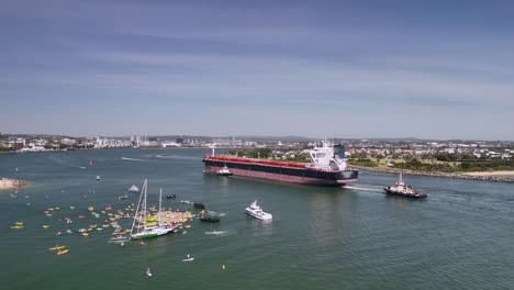 kayakers gather to protest oil tanker entering newcastle harbour, nsw