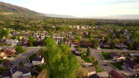 a floating drone shot over a main road in the suburbs part of utah