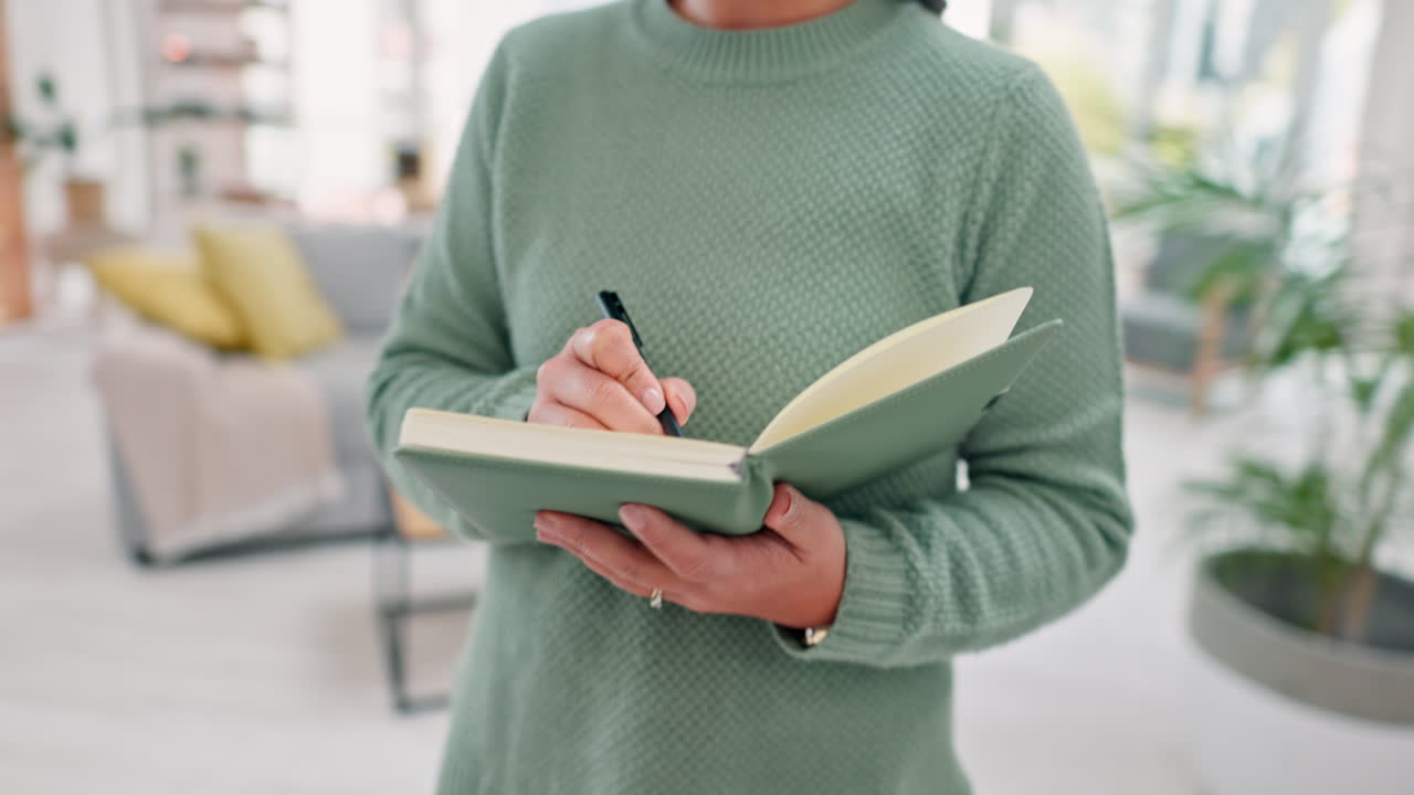 Woman, writing in notebook and remote work